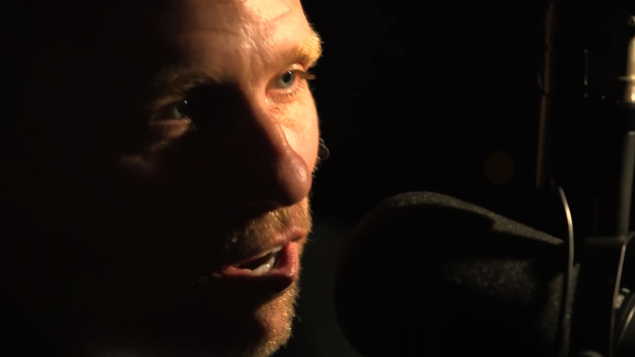Cary Harrison at the studio microphone